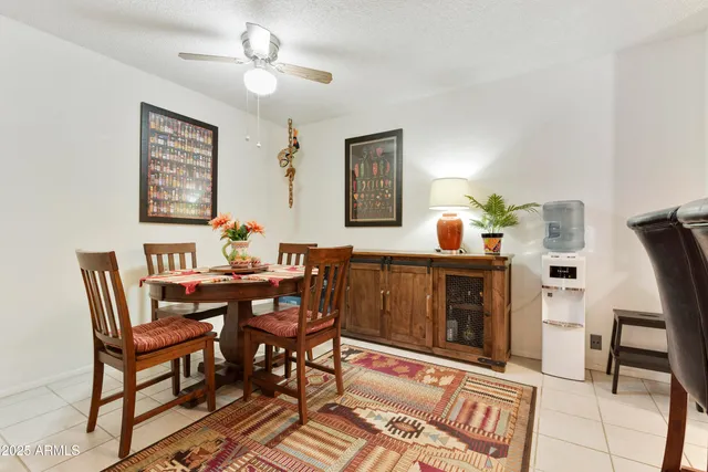 a dining room with furniture and window