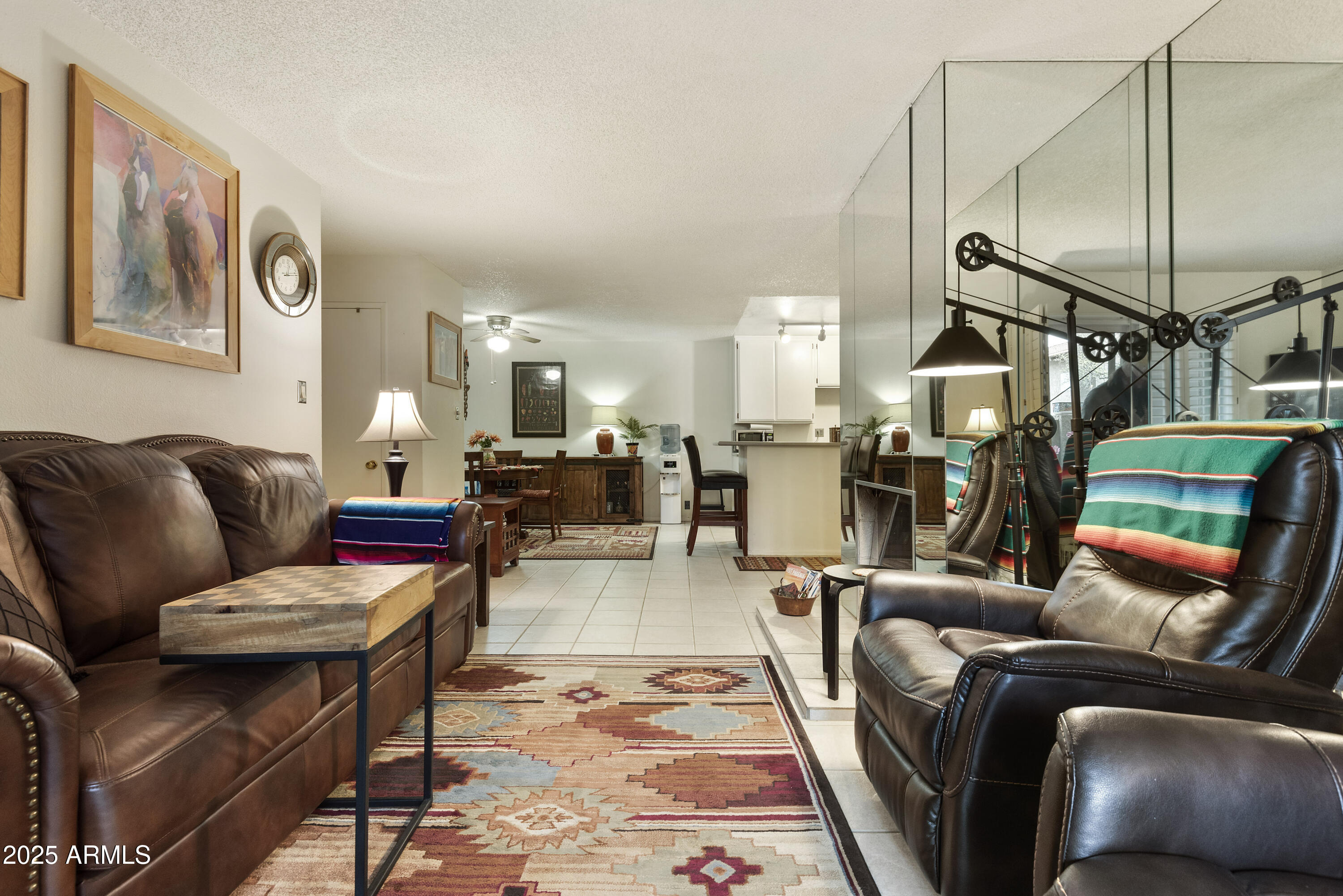5525 East Thomas Road, Unit M16 Phoenix, AZ 85018 - Photo 6 of 27 a living room with furniture and a wooden floor