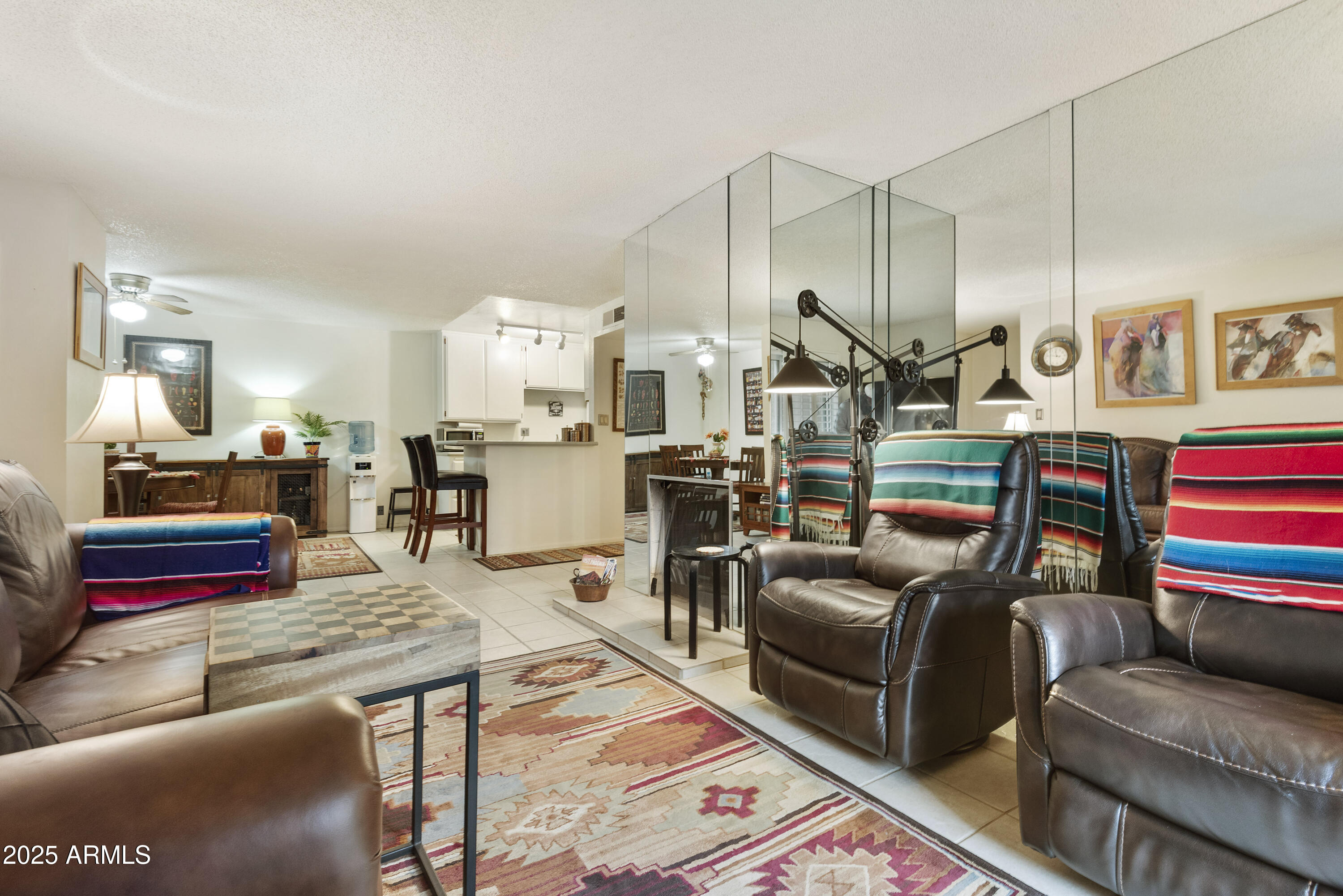 5525 East Thomas Road, Unit M16 Phoenix, AZ 85018 - Photo 7 of 27 a living room with furniture kitchen view and a wooden floor