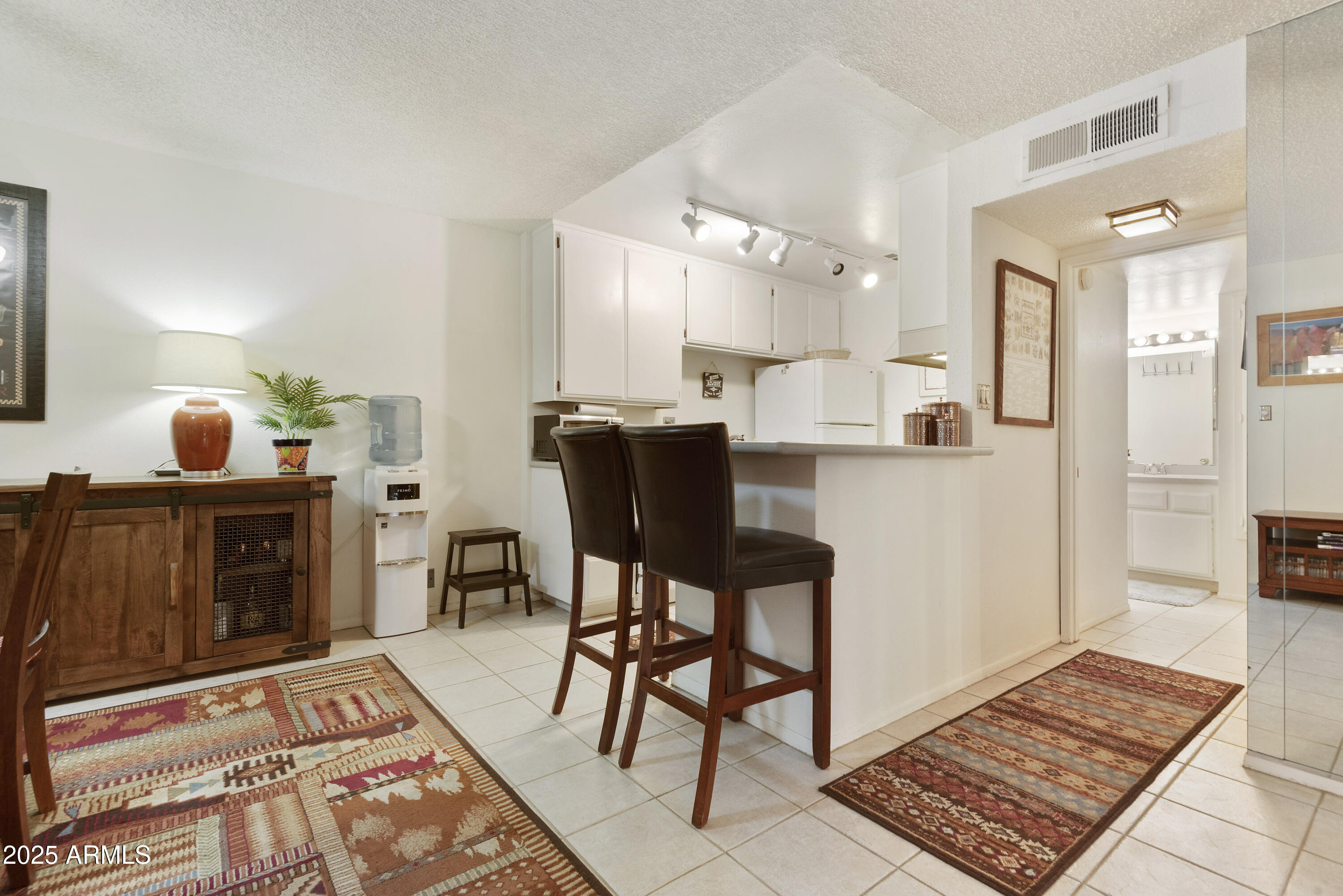 5525 East Thomas Road, Unit M16 Phoenix, AZ 85018 - Photo 8 of 27 a view of a dining room with furniture and wooden floor
