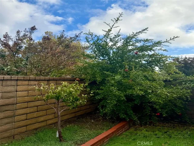 a backyard of a house with lots of green space