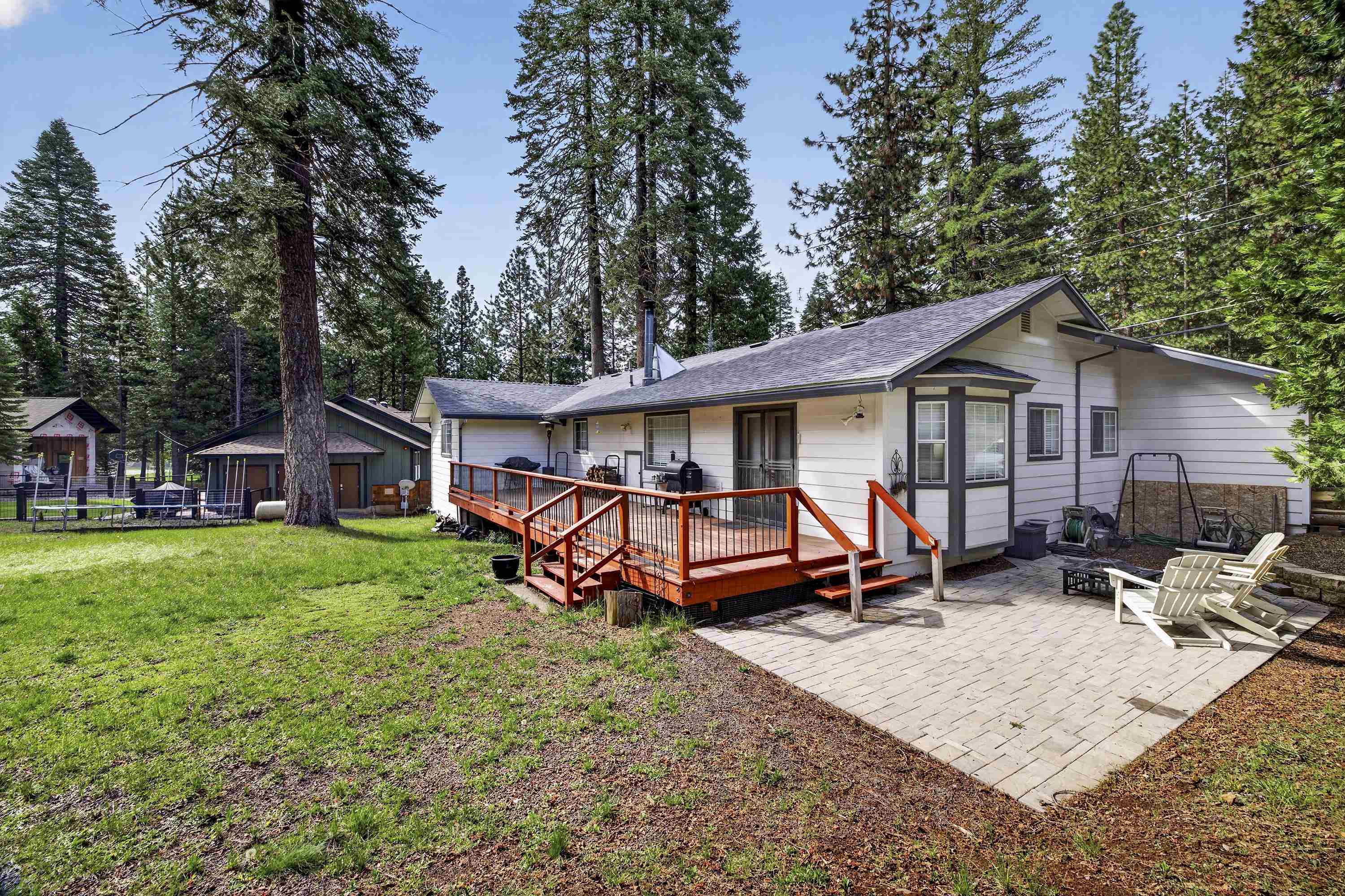 811 Golf Club Road Lake Almanor, CA 96137 - Photo 36 of 42 a view of a house with backyard and sitting area