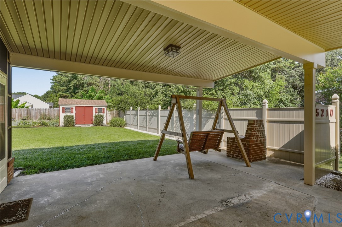 5210 Ronson Road North Chesterfield, VA 23234 - Photo 33 of 35 Covered concrete patio with a brick column and ove