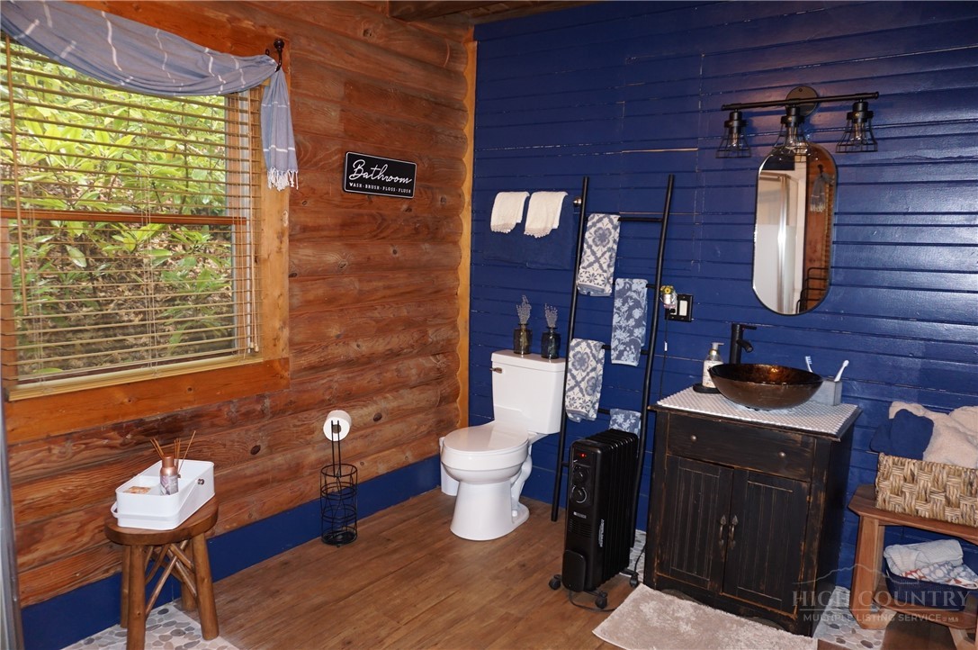 557 White Pine Road Newland, NC 28657 - Photo 10 of 41 a bathroom with a toilet and a sink
