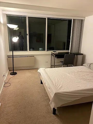 211 East Ohio Street, Unit 1003 Chicago, IL 60611 - Photo 10 of 11 a bathroom with a sink and a mirror