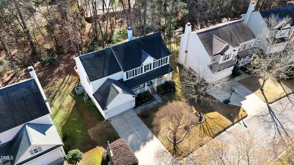 a view of a livingroom with wooden floor and staircase