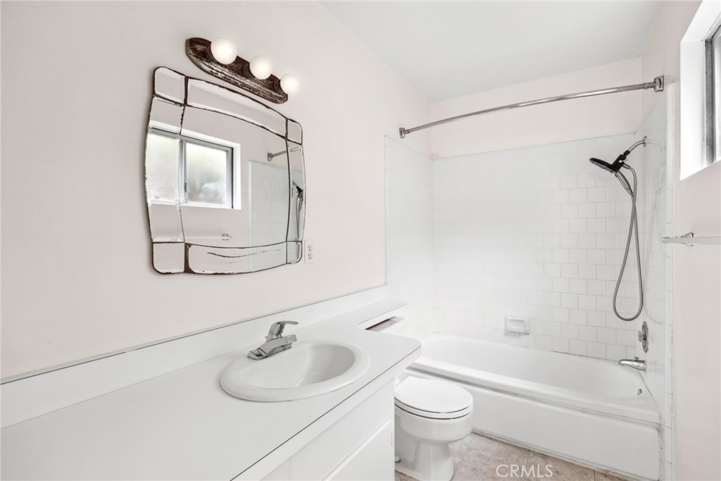 505 Graceland Drive Laguna Beach, CA 92651 - Photo 15 of 29 a bathroom with a granite countertop sink a toilet and shower