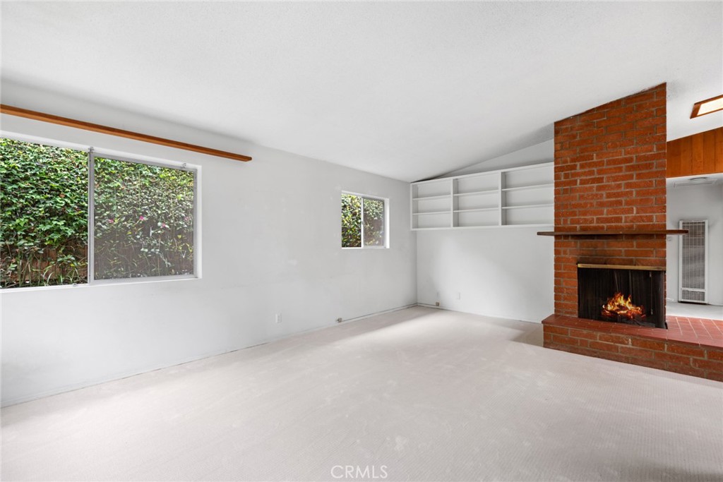 505 Graceland Drive Laguna Beach, CA 92651 - Photo 3 of 29 a view of a livingroom with a fireplace and window