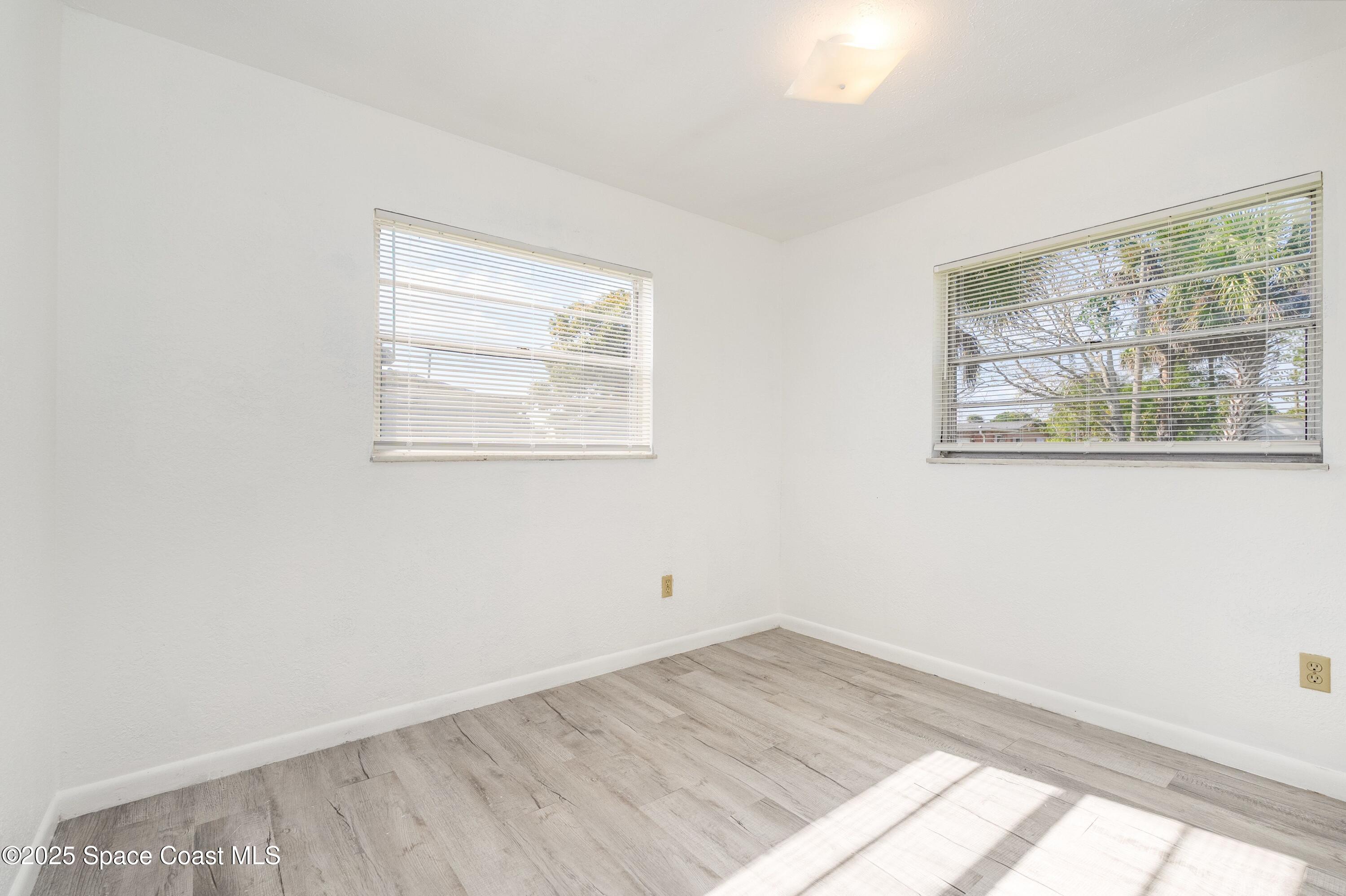 557 Cox Street Cocoa, FL 32926 - Photo 14 of 20 an empty room with a window