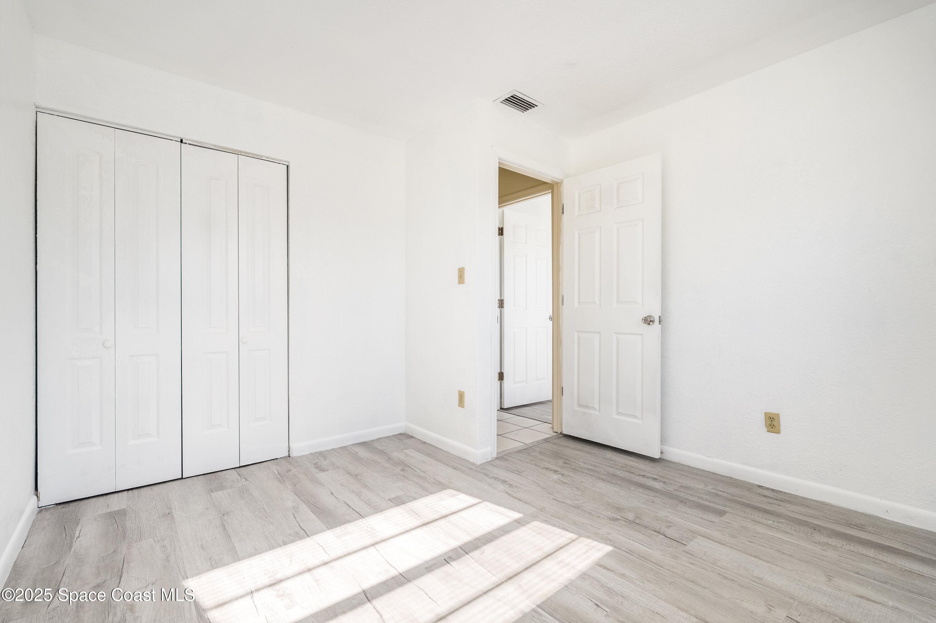 557 Cox Street Cocoa, FL 32926 - Photo 15 of 20 a view of a room with wooden floor