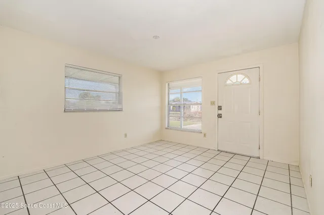 a view of an empty room and window