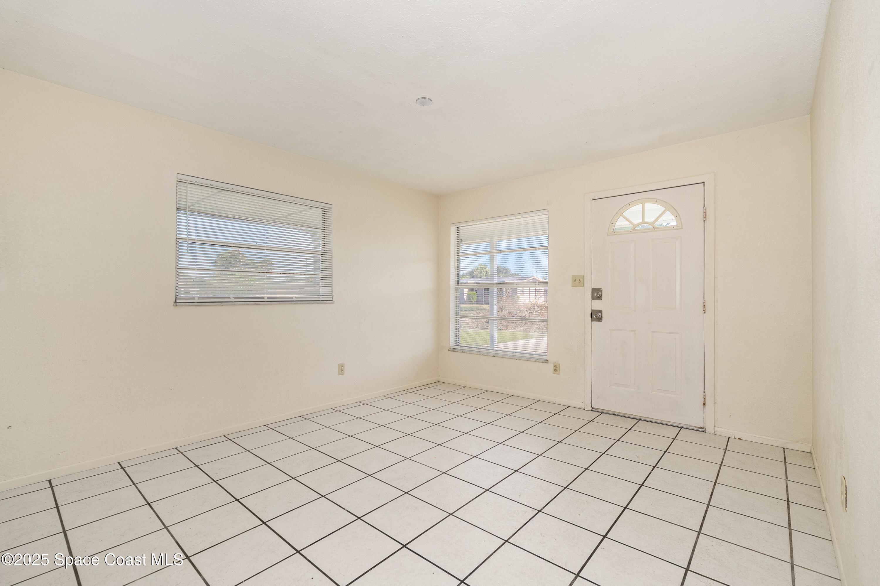 557 Cox Street Cocoa, FL 32926 - Photo 2 of 20 a view of an empty room and window