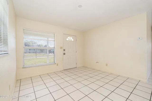 a view of an empty room and window