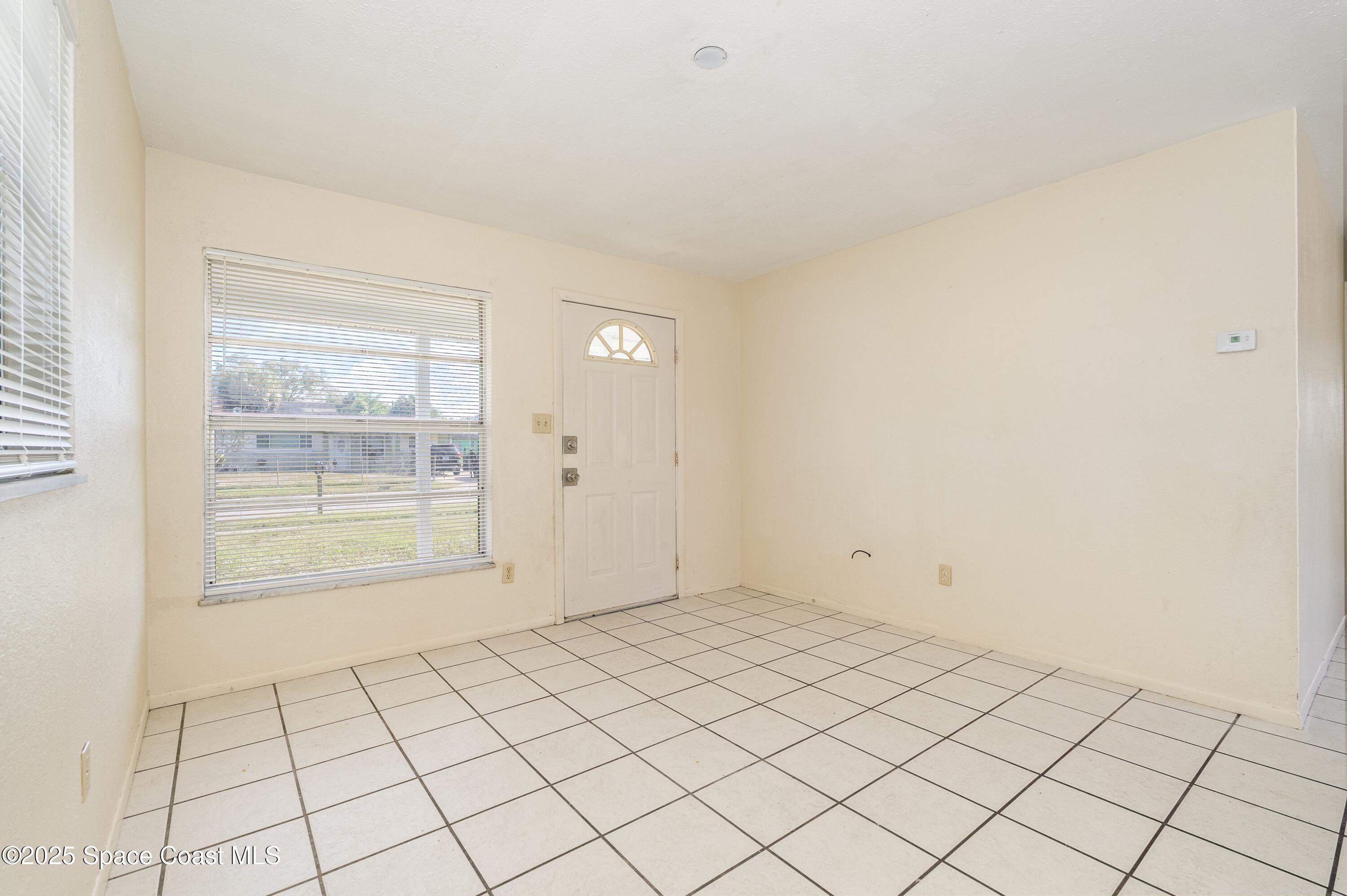 557 Cox Street Cocoa, FL 32926 - Photo 3 of 20 a view of an empty room and window