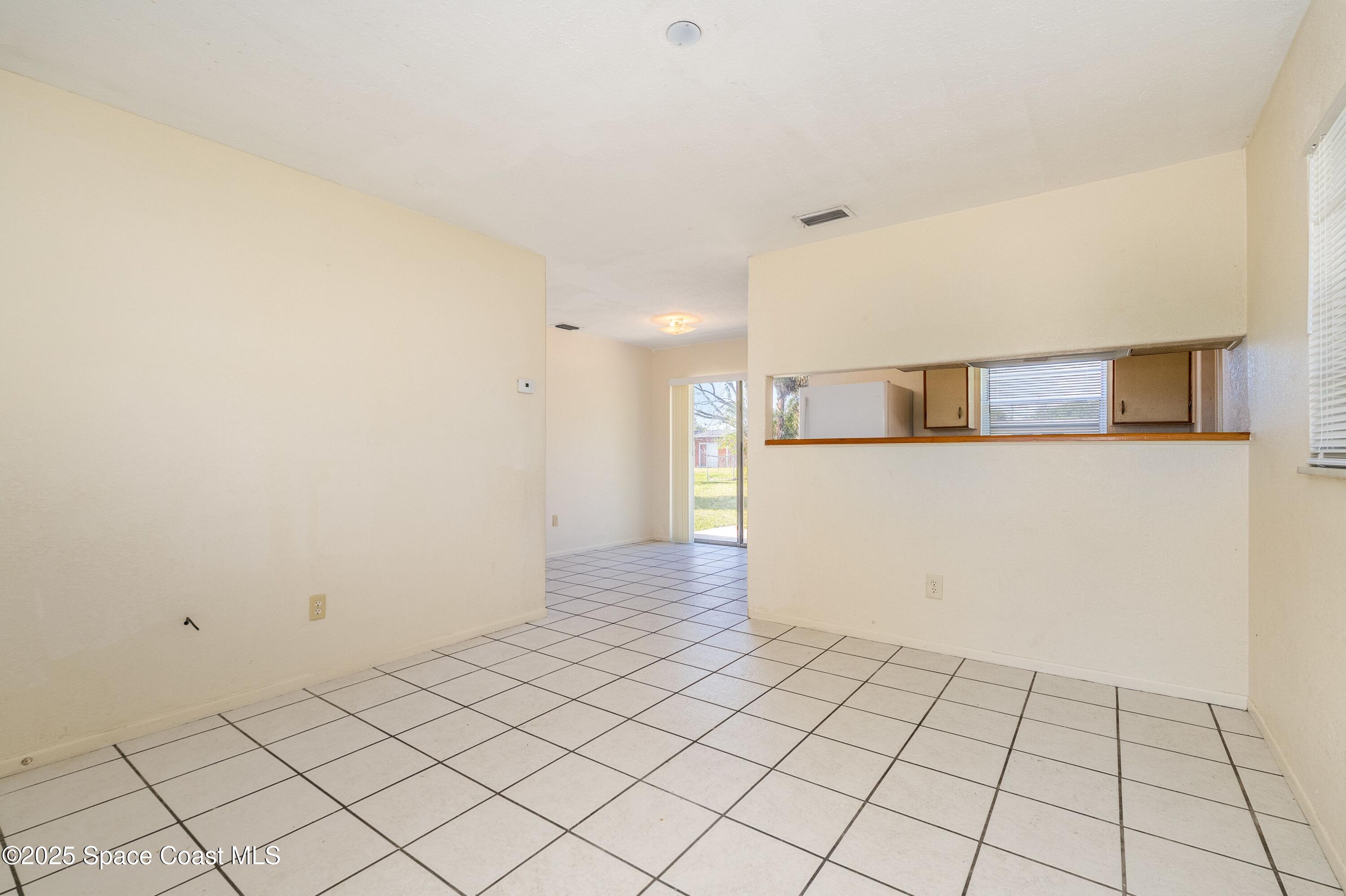 557 Cox Street Cocoa, FL 32926 - Photo 4 of 20 a view of a kitchen with white cabinets