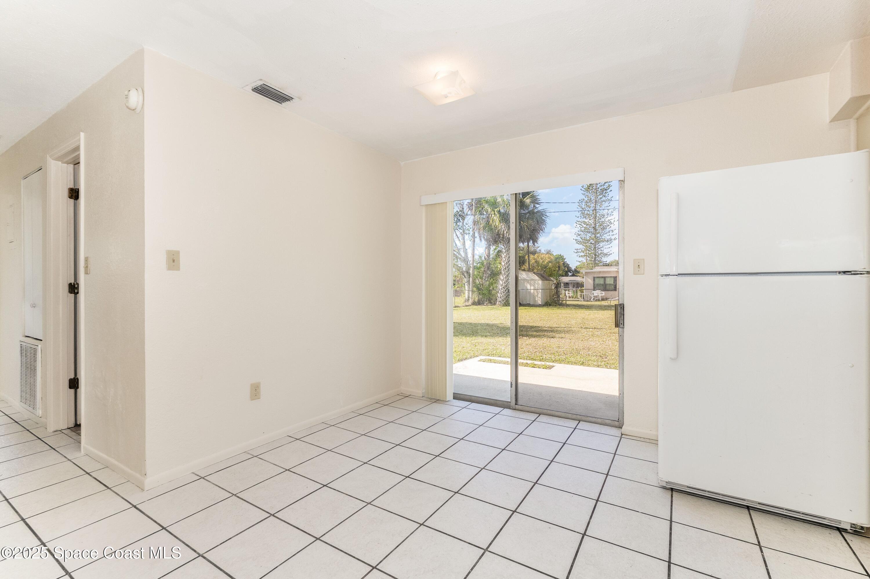 557 Cox Street Cocoa, FL 32926 - Photo 8 of 20 a view of an empty room and window