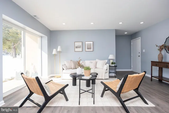 a dining room with furniture and wooden floor