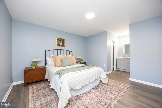 a bedroom with a bed and a lamp