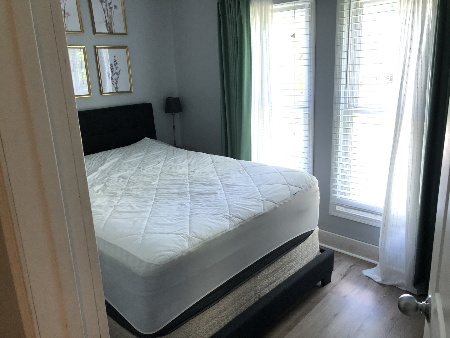 1011 West Church Street Champaign, IL 61821 - Photo 11 of 20 a bed sitting in a bedroom next to a window