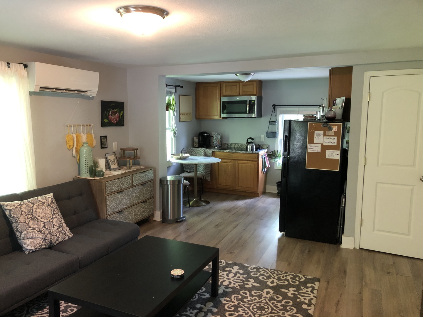 1011 West Church Street Champaign, IL 61821 - Photo 12 of 20 a living room with furniture and a flat screen tv