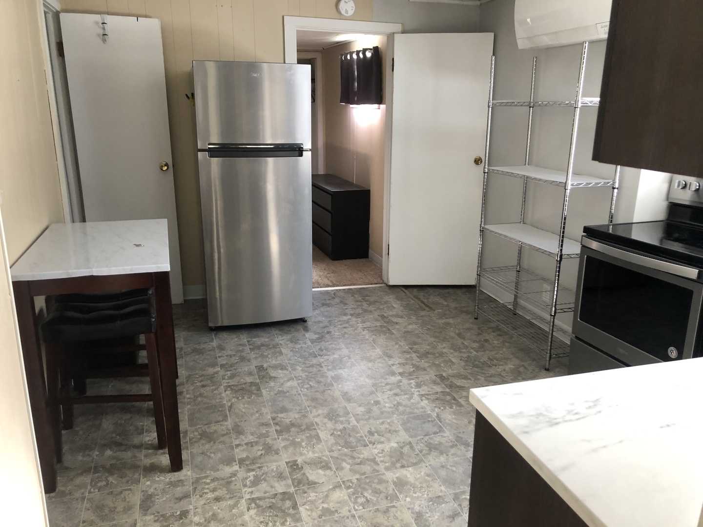 1011 West Church Street Champaign, IL 61821 - Photo 18 of 20 a kitchen with metallic refrigerator freezer and a dishwasher