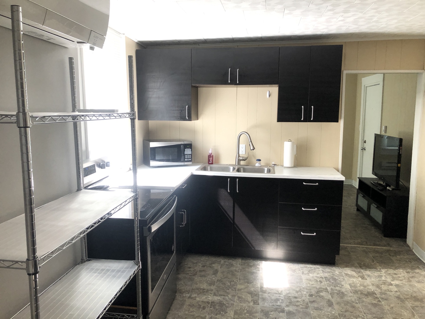 1011 West Church Street Champaign, IL 61821 - Photo 19 of 20 a kitchen with a sink appliances and cabinets