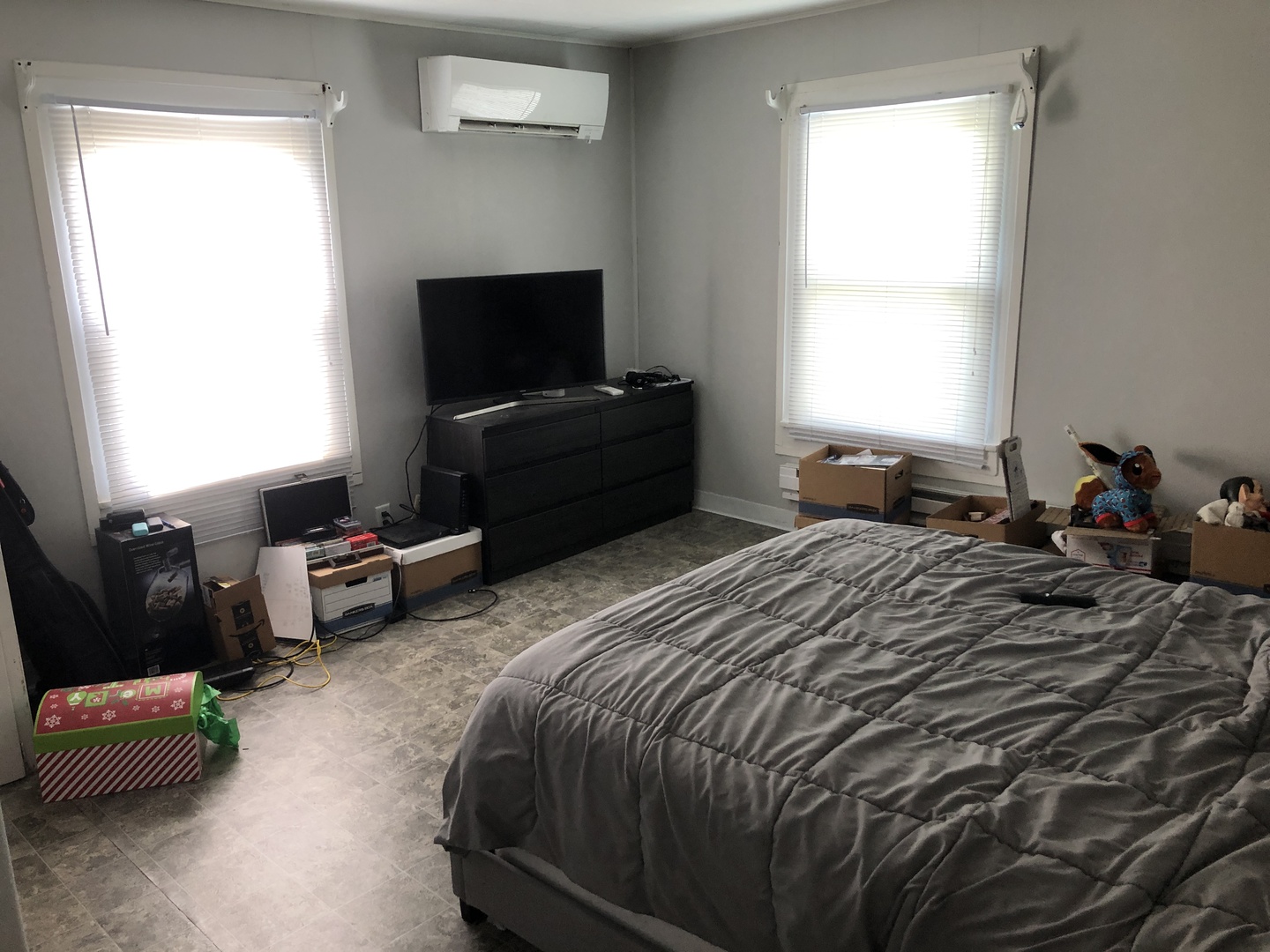 1011 West Church Street Champaign, IL 61821 - Photo 6 of 20 a bedroom with a bed and a flat screen tv