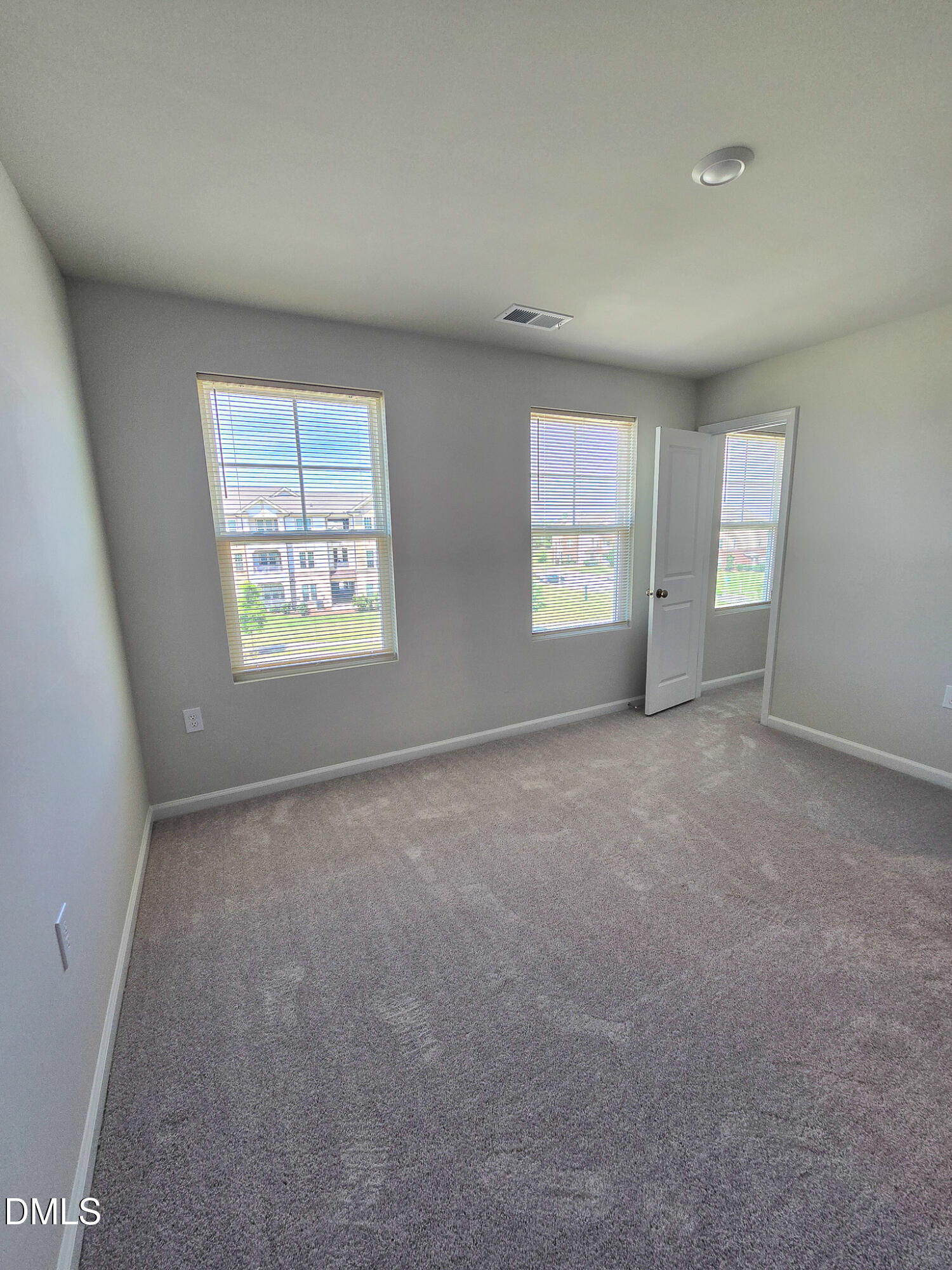 2431 Kasota Lane Raleigh, NC 27610 - Photo 37 of 46 an empty room with windows