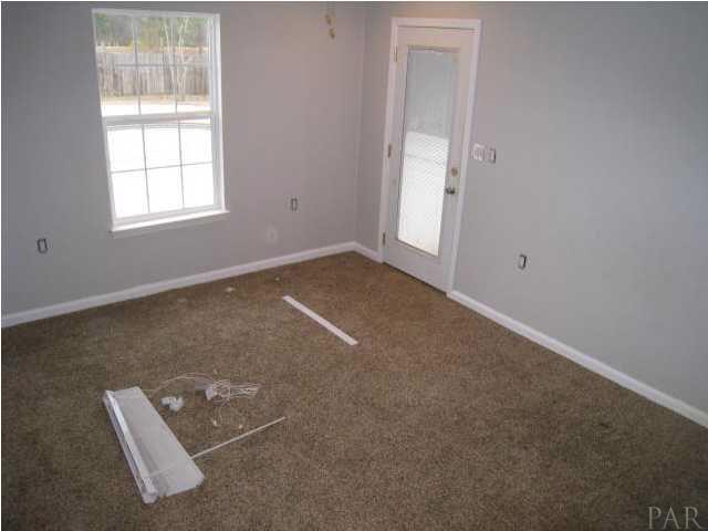 2095 Well Line Road Cantonment, FL 32533 - Photo 11 of 20 spare bedroom with access door to the pool.