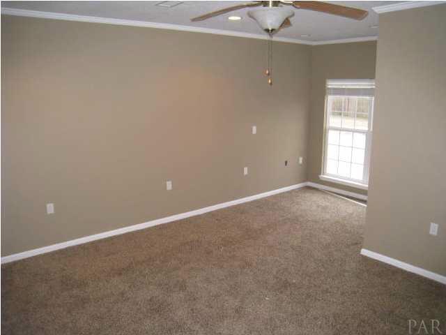 2095 Well Line Road Cantonment, FL 32533 - Photo 4 of 20 Master Bedroom with sitting area and view of the pool.
