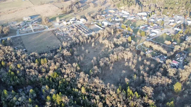 a view of a backyard of a house with a street