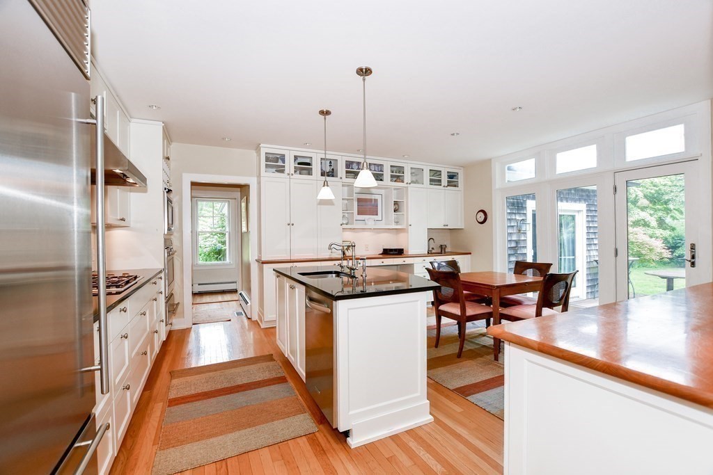 594 Point Road Marion, MA 02738 - Photo 20 of 37 a kitchen with stainless steel appliances granite countertop a stove and a refrigerator