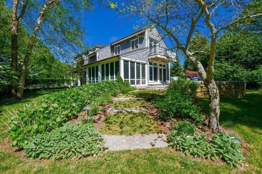 594 Point Road Marion, MA 02738 - Photo 2 of 37 a front view of a house with a yard