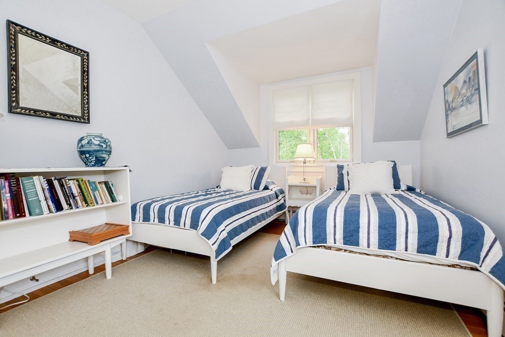 594 Point Road Marion, MA 02738 - Photo 29 of 37 a bedroom with furniture and a book shelf