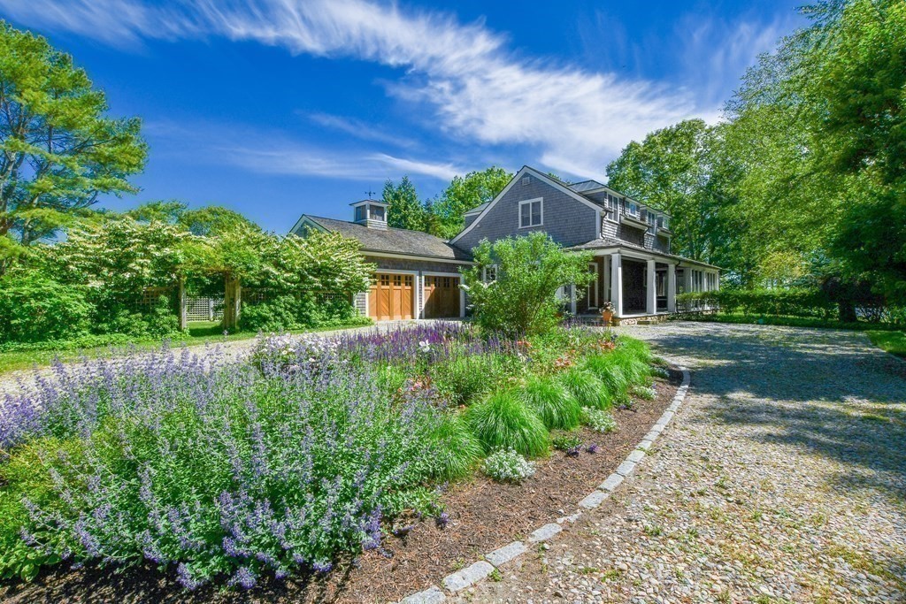 594 Point Road Marion, MA 02738 - Photo 3 of 37 a front view of a house with garden