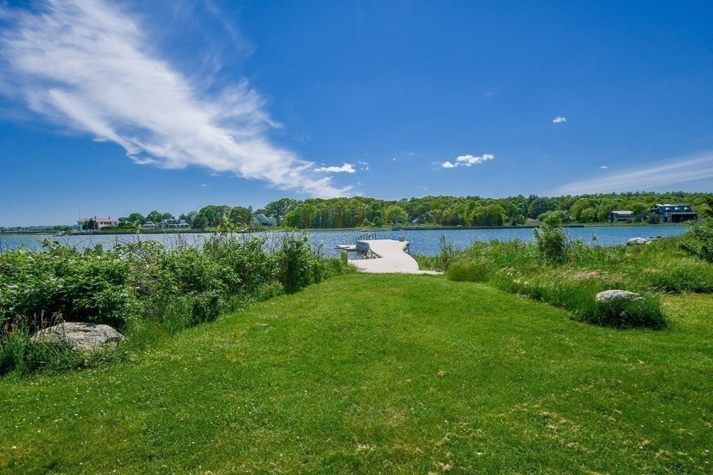 594 Point Road Marion, MA 02738 - Photo 6 of 37 a view of a lake with green field