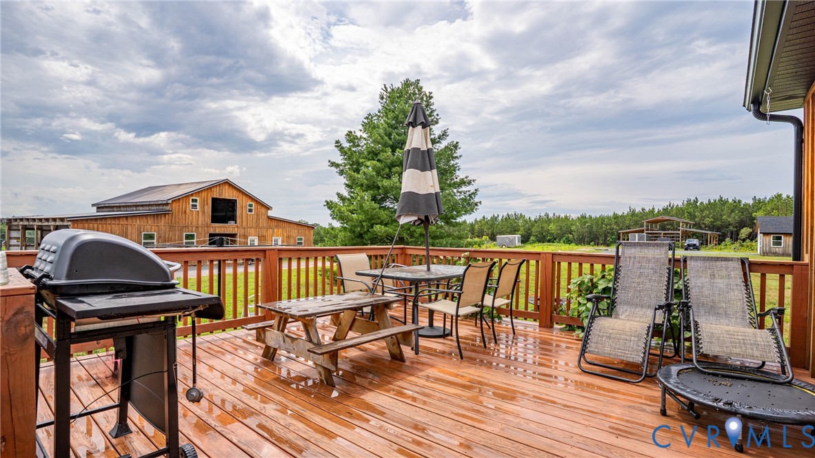 1451 Dixie Hill Road Dillwyn, VA 23936 - Photo 25 of 51 Expansive outdoor deck featuring wood-finish floor