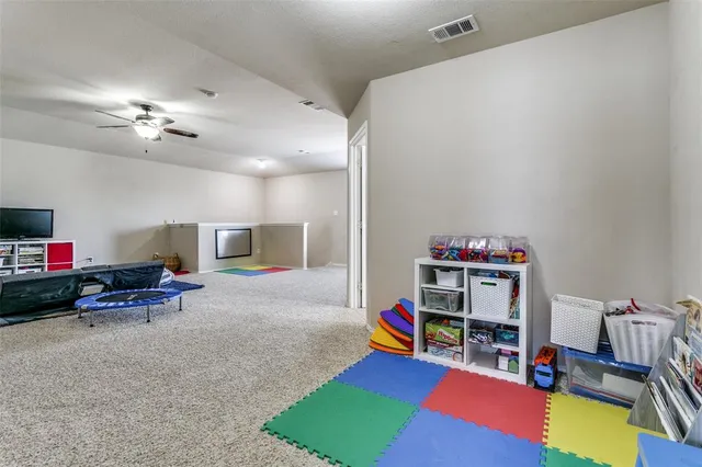 a white bath tub sitting next to a bathroom