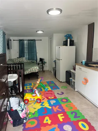 a very nice looking bedroom with a bed furniture and a flat screen tv