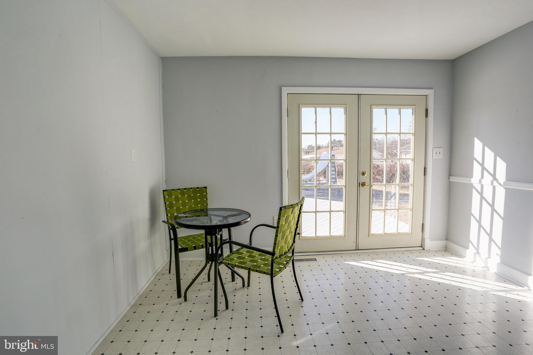 1201 Meadow View Road Pasadena, MD 21122 - Photo 13 of 34 Sun room leading to deck and pool.