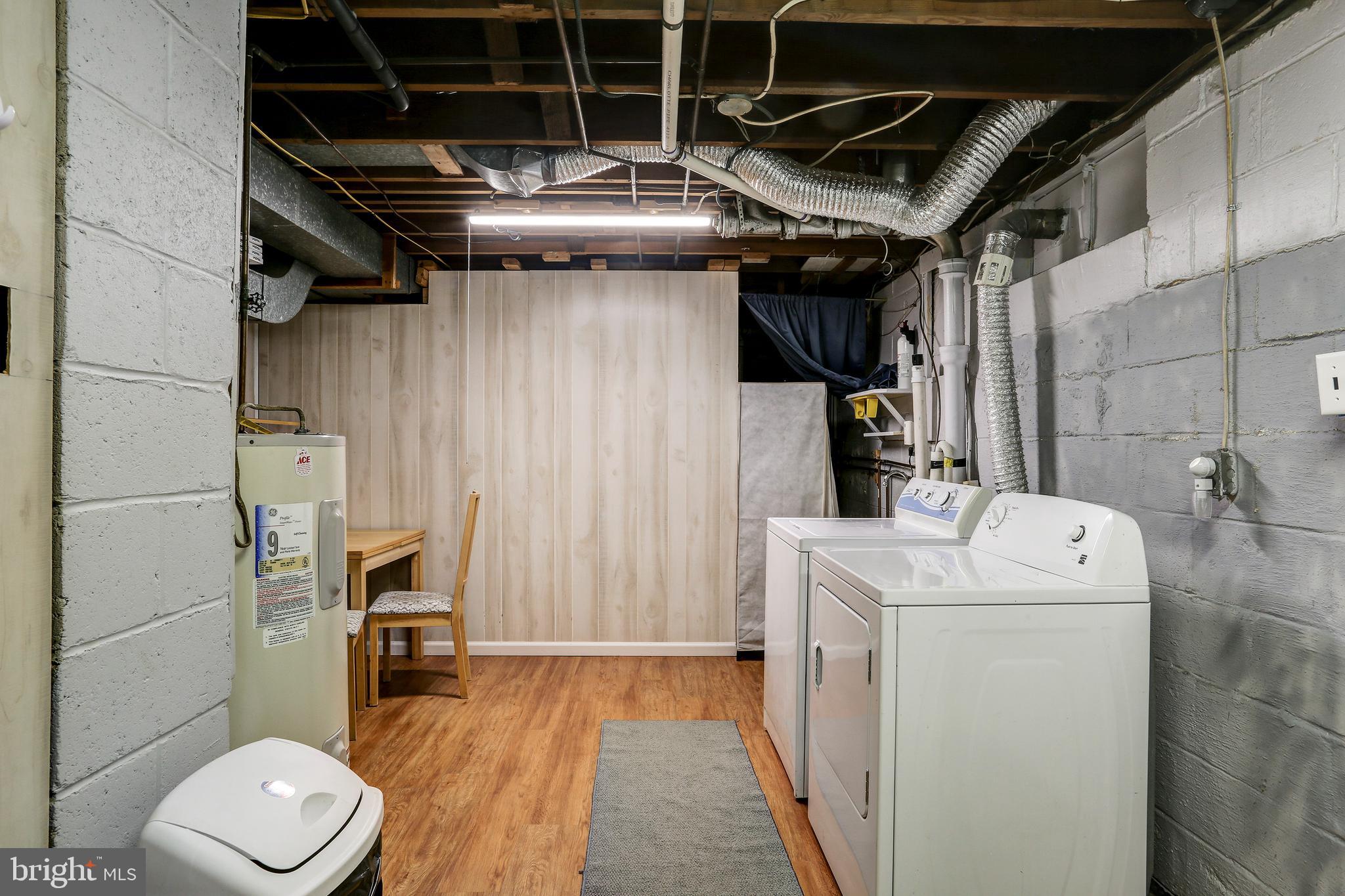 1201 Meadow View Road Pasadena, MD 21122 - Photo 23 of 34 Lower level washer/dryer and kitchenette area.