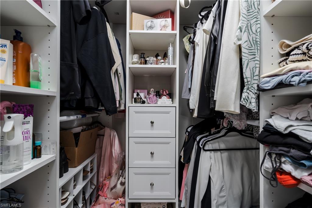 5170 19th Court Southwest Naples, FL 34116 - Photo 16 of 32 a view of walk in closet with clothes and shoes