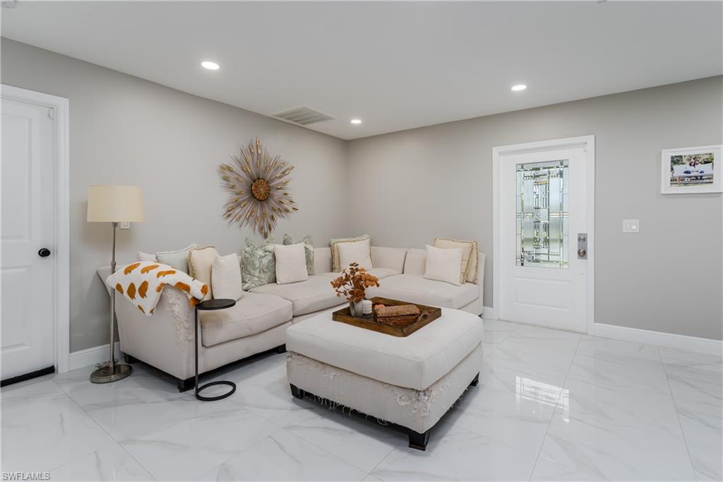 5170 19th Court Southwest Naples, FL 34116 - Photo 4 of 32 a living room with furniture