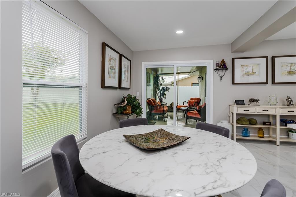 5170 19th Court Southwest Naples, FL 34116 - Photo 10 of 32 a view of a dining room with furniture window and outside view