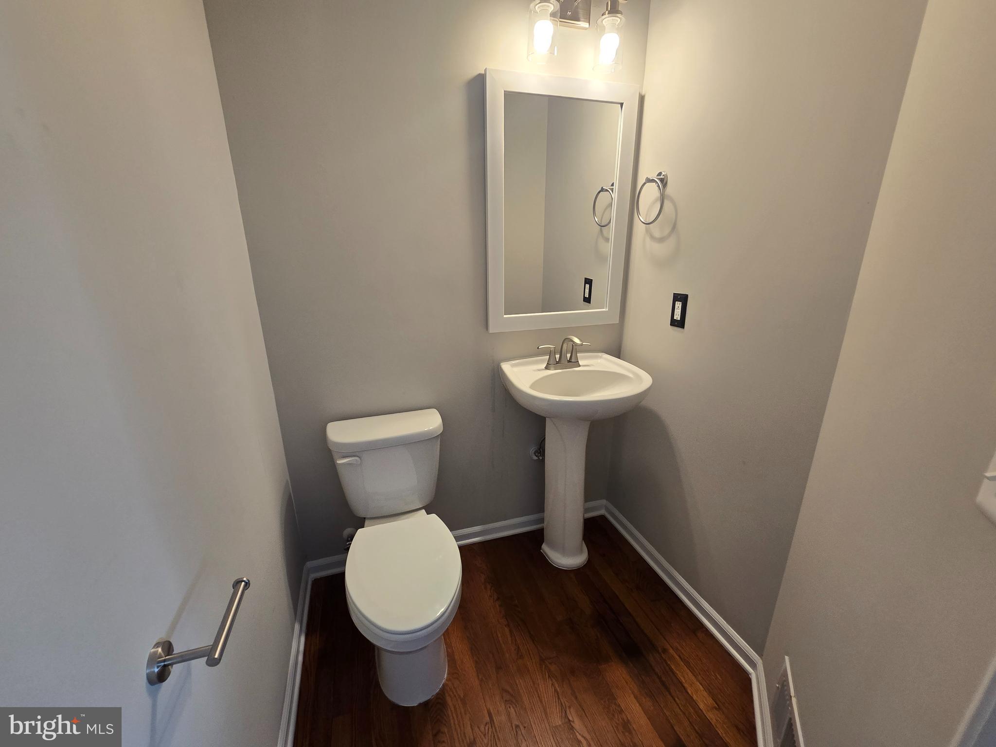 1248 Steed Street Ranson, WV 25438 - Photo 19 of 42 a bathroom with a toilet sink and mirror
