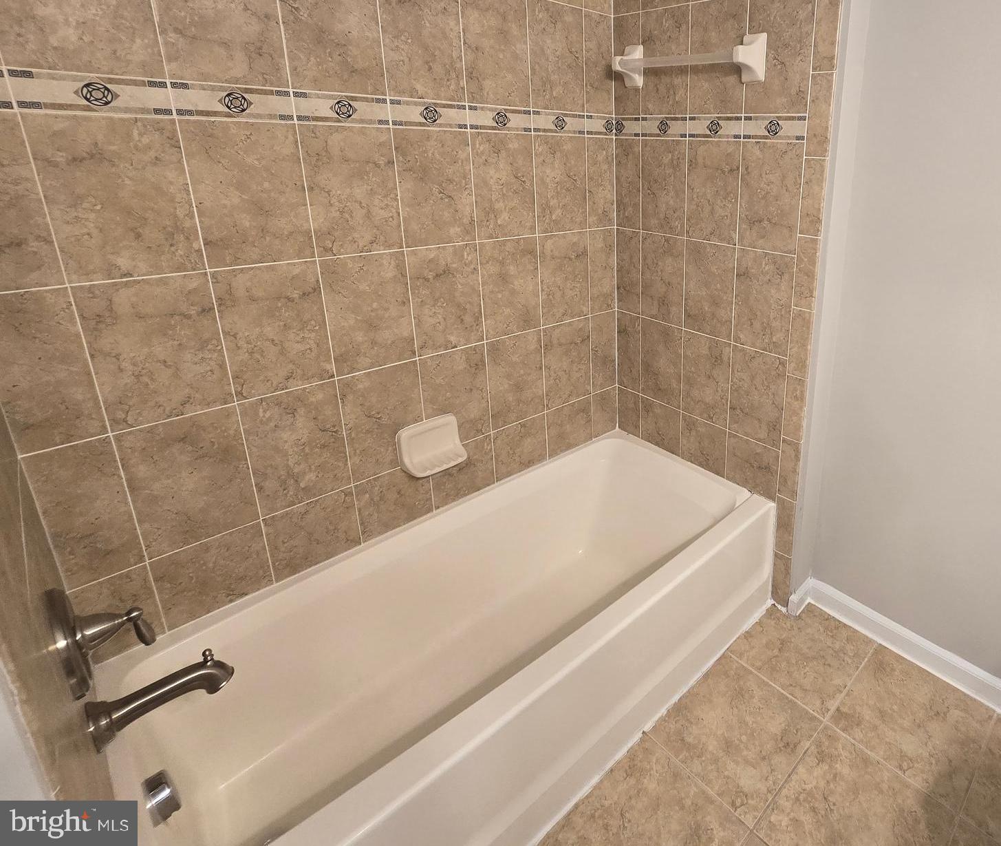 1248 Steed Street Ranson, WV 25438 - Photo 31 of 42 a bath tub sitting next to a shower