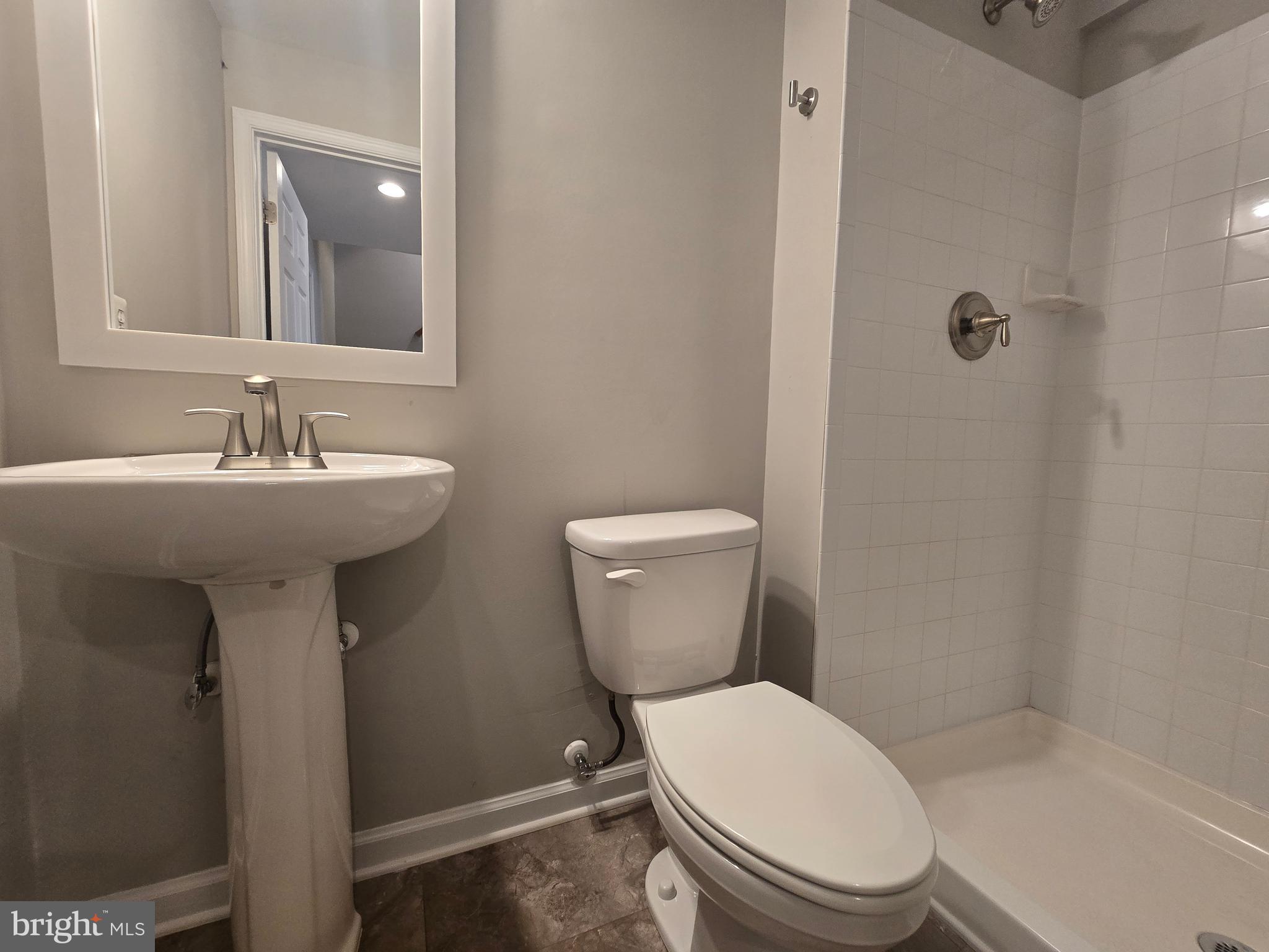 1248 Steed Street Ranson, WV 25438 - Photo 34 of 42 a bathroom with a sink a toilet and mirror
