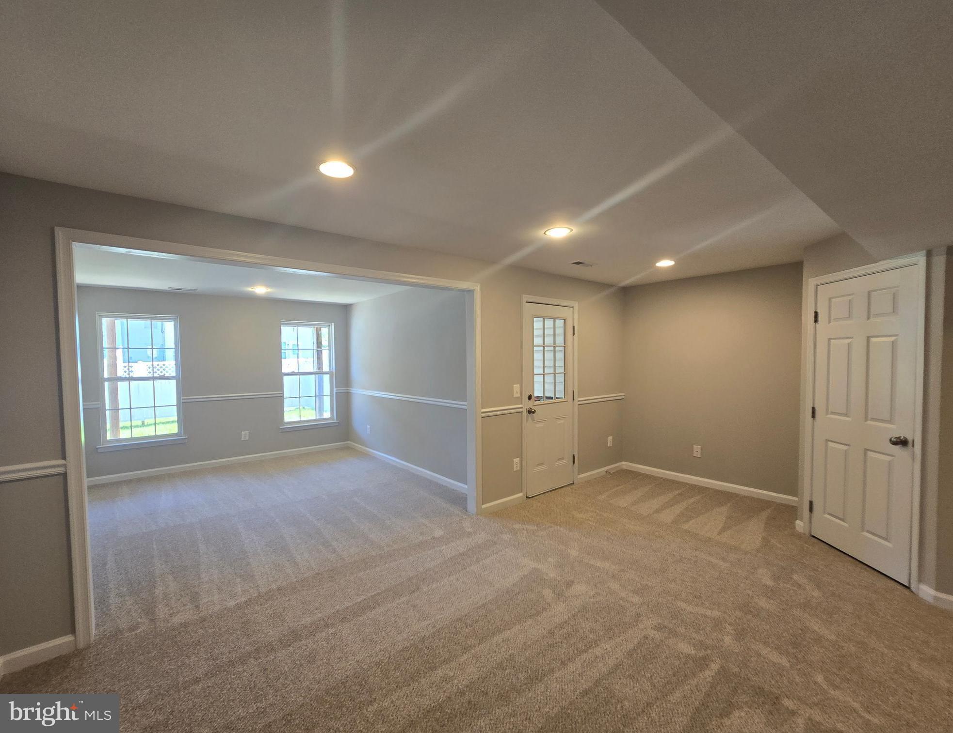 1248 Steed Street Ranson, WV 25438 - Photo 35 of 42 an empty room with windows and pillars in it