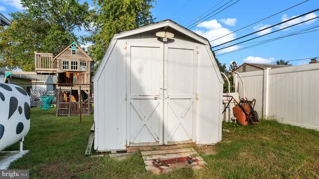 a view of a wooden house with a yard