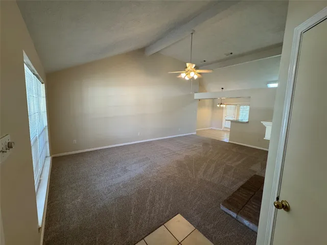wooden floor in an empty room with a mirror
